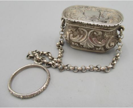 Victorian silver vinaigrette in the form of a handbag on a chain with finger ring handle, chased and engraved scrolling and f