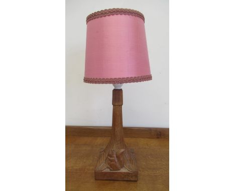 Wilf Squirrelman Hutchinson of Husthwaite- an oak table lamp octagonal column on a square base, carved with signature squirre