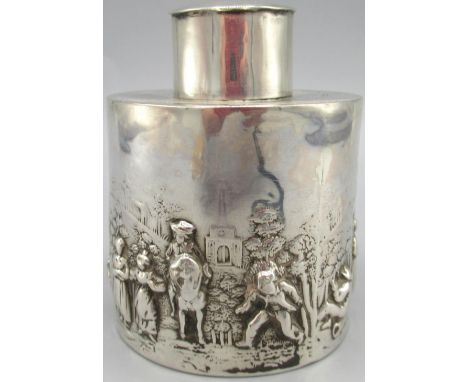 Edwardian silver tea caddy, cylindrical body decorated in a repousse country scene with figures and town to the background, b