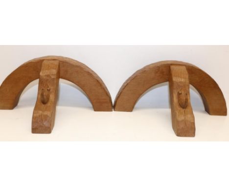 Robert Mouseman Thompson of Kilburn - a pair of demi-lune adzed oak wall lights, shaped support carved with signature mouse, 