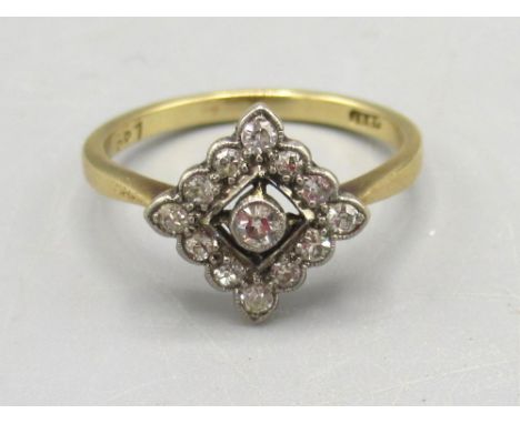 18ct yellow gold ring set with diamonds, the central stone surrounded  by a diamond border, on plain band, stamped 18ct, size