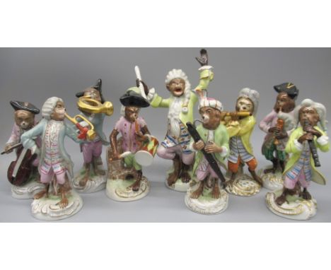 Set of eight Sitzendorf Monkey bandsmen, each playing a different instrument, with conductor, all enamelled in Meissen palett