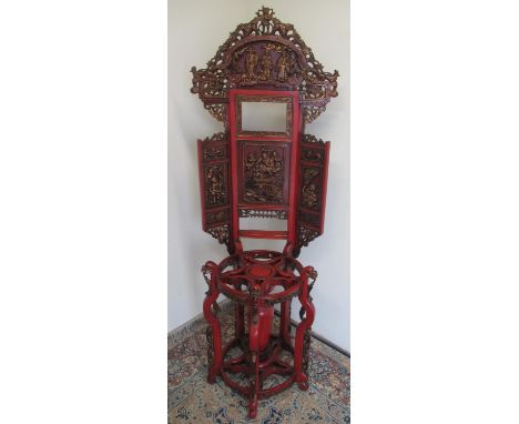 19th century Chinese red painted washstand, carved panels with gilt detail, raised back with carved cresting above stick prov