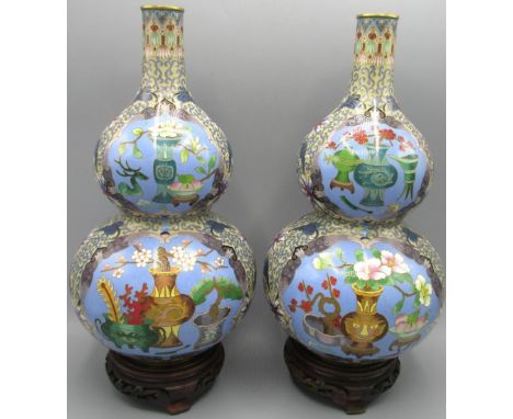 Pair of Chinese Cloisonne double gourd shaped vases, decorated with flower vases in blue reserve panels on a yellow scroll an