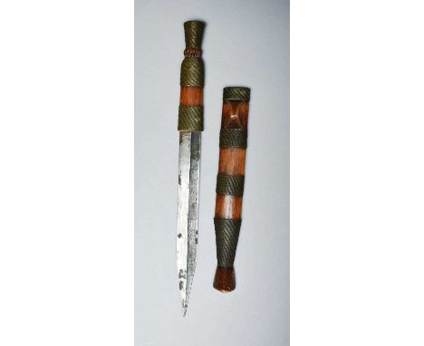 A Shona dagger bakatwaZimbabwewith a part blackened iron blade, the diamond knop handle and loop front scabbard with brass wi
