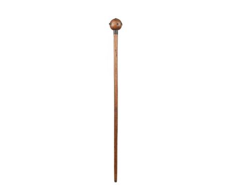A Zulu knobkerrieSouth Africawith metal studs to the spherical head and a metal collar to the top of the shaft,92.5cm long.