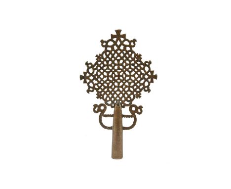 An Ethiopian processional cross15th centurybronze, the interlaced openwork design framing nine small crosses, with four furth