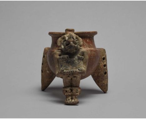 An Atlantic Watershed Region tripod vesselCosta Rica, circa 300 - 700 ADpottery with a standing male figure support, wearing 