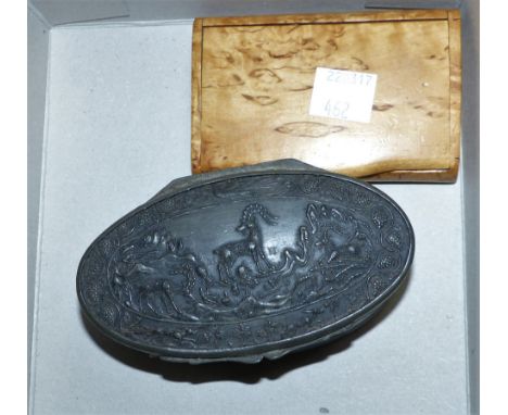 A late 18th/early 19th century pewter oval snuff box, the top and bottom panels of horn carved with ibex hunting scenes, leng