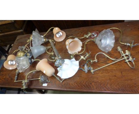 An Edwardian rise and fall 2-branch brass centre light; 10 other Edwardian brass wall lights, some with shades