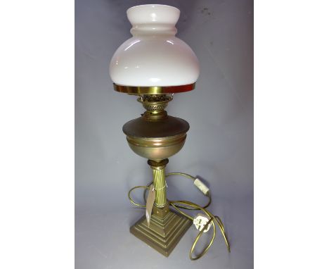 A 19th century brass oil lamp with Corinthian columns and raised on square stepped base (later converted to electricity)