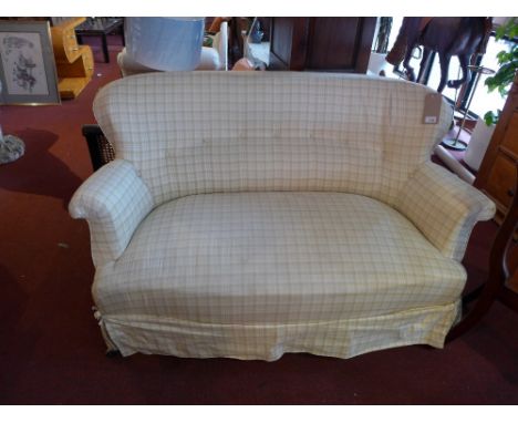 A Victorian mahogany framed two seater sofa with new button back upholstered raised on turned legs and castors, H:85cm W:140c