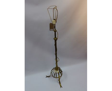 A 20th century brass telescopic standard lamp raised on three splayed feet