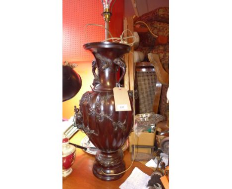 A 20th Century Japanese bronze lamp with twin elephant head handles, applied birds and flowers. H-62cm