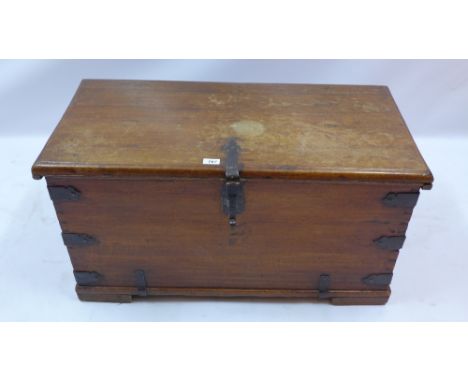 A 19th Century iron bound mahogany trunk with fitted candle box, H:50cm W:93cm D:46cm