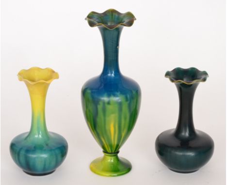 Linthorpe Pottery - Two early 20th Century shape 1748 vases each of globe and shaft form with frilled rim edges, the first gl