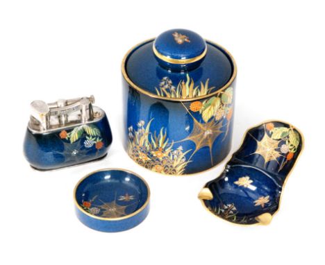 Carlton Ware - Dunhill - A 1930s smokers set decorated in the Spiders Web pattern comprising a lighter, ashtray and tobacco j