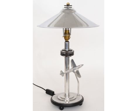 Unknown - An Art Deco style chrome plated lamp, designed with an aeroplane in flight beside a chrome lamp with columnar base 