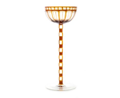 Otto Prutscher - Meyr's Neffe - A stemmed wine glass circa 1906 with a circular spread foot below a ladder cut stem and ovoid