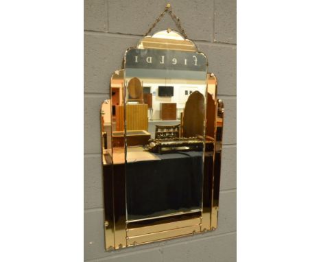 Unknown - A bevelled wall mirror with cloud shaped top and with smoked peach coloured borders, height 90cm and width 54cm.