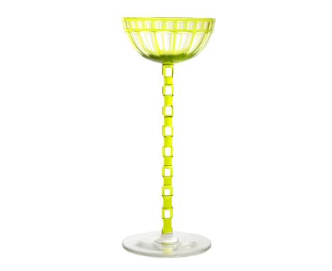 Otto Prutscher - Meyr's Neffe - A stemmed wine glass circa 1906 with a circular spread foot below a ladder cut stem and ovoid