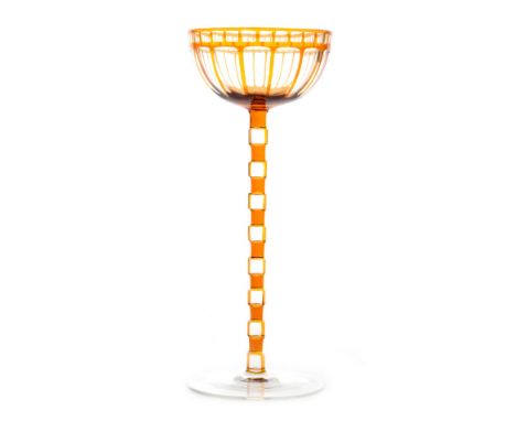 Otto Prutscher - Meyr's Neffe - A stemmed wine glass circa 1906 with a circular spread foot below a ladder cut stem and ovoid