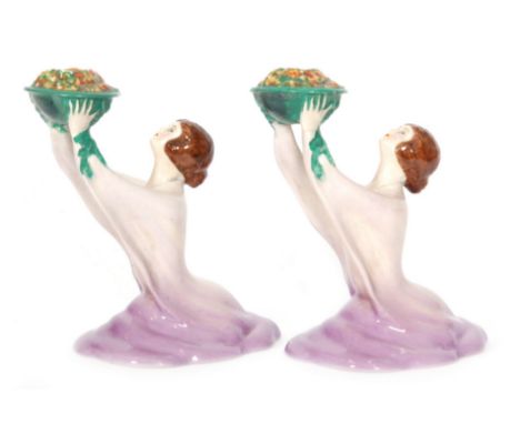 Clarice Cliff - Lady Candlestick - A pair of candlesticks circa 1930 modelled as ladies in flowing robes holding aloft a bowl
