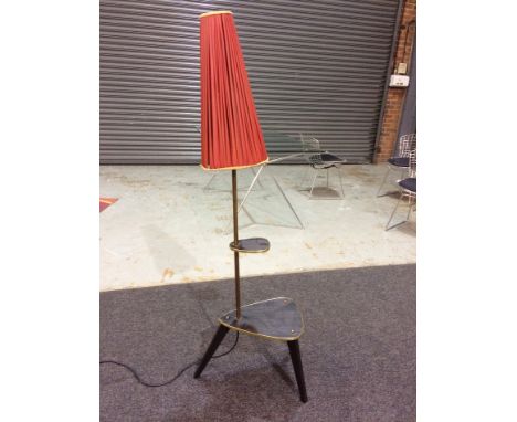 Unknown - A 1950s floor lamp with built in coffee table of amorphic shape and raised on dansette style legs