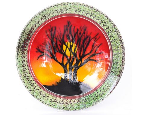 Alan White - Poole Pottery - A large unique plaque of shallow circular form titled Dorset Dawn with Yellow sun, decorated wit
