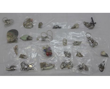Twenty-five silver and silver mounted pendants and chains 