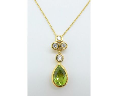 A silver gilt peridot and zircon pendant and chain