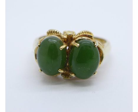 A silver gilt and chalcedony cabochons ring, L 