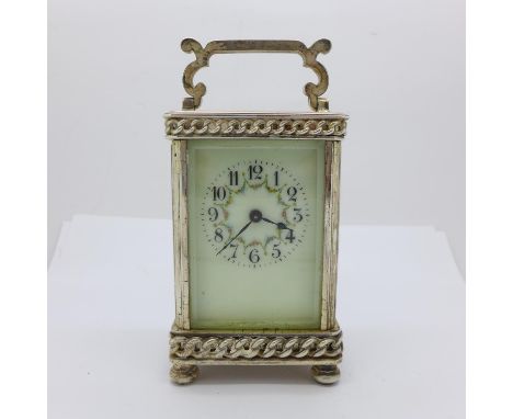 A silver plated carriage clock, with key 