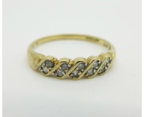 A 9ct gold ten stone diamond ring, 0.2 carat diamond weight, 1.8g, R/S 