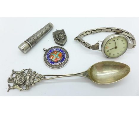 A silver wristwatch, a Victorian silver locket, a silver and enamel Nottingham Spartan football league fob medal, etc. 