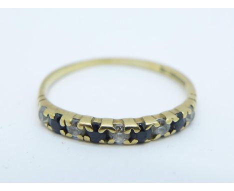 A 9ct gold ring with small sapphire and diamonds, 0.8g, M 