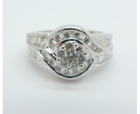 An 18ct white gold and diamond ring, 0.75 carat diamond weight, marked on the shank, 6.1g, M