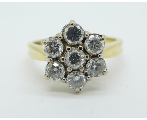 A seven stone diamond daisy cluster ring, 3.8g, M 