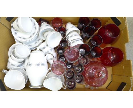 A collection of ruby glass, cranberry glass and a retro tea and coffee service 