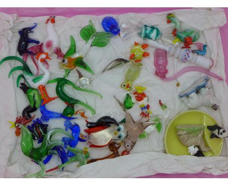 A collection of glass and enamel figures and three items of Wade 