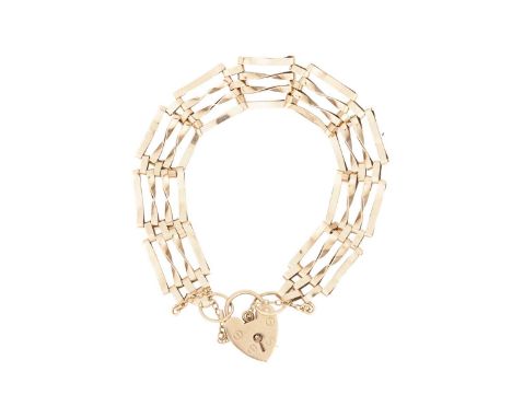 A gate link bracelet in 9ct yellow gold, formed of four rows of plain and twisted links, completed with a heart-shaped padloc