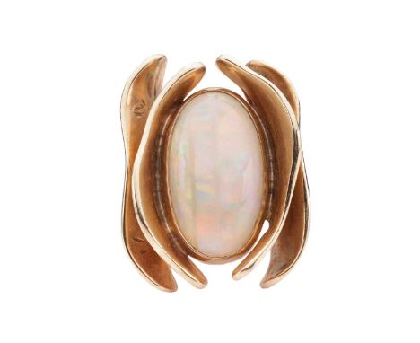 An opal dress ring of stylised design, featuring a bezel set precious opal, measuring approximately 18.7mm x 10.8mm, with a s