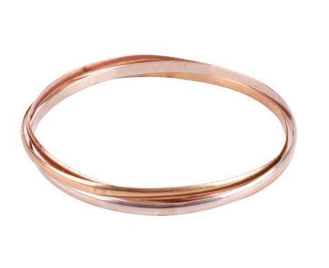 A 9ct tri-colour gold Russian bangle, with three interlocking round court-shaped bangles, the inner diameter measuring approx