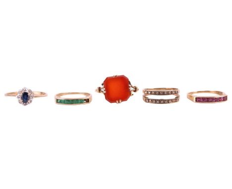 A group lot of rings. Includes a carnelian dress ring, the square cut carnelian is within a four claw mount, with scroll shou