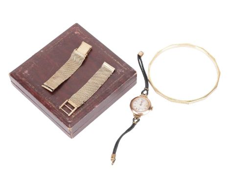 A small collection of items including a 9ct yellow gold large bangle together with a 9ct yellow gold mesh watch strap and a R