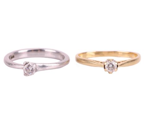 Two diamond solitaire rings, the first claw-set with a round brilliant diamond measuring approximately 3.8mm, with an estimat