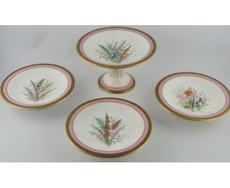 A set of four late 19th century Worcester comports, decorated with summer flowers, within a pink band and gilt decoration, on