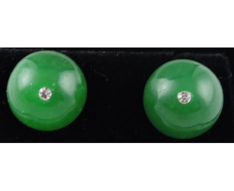 A pair of jade ear studs, set with white metal stamped 925.