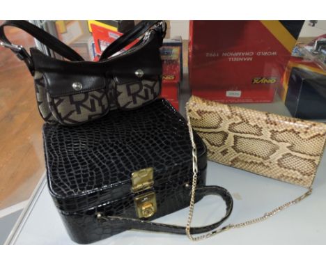 A 1970's snakeskin handbag together with a faux alligator vanity case and a DKNY handbag