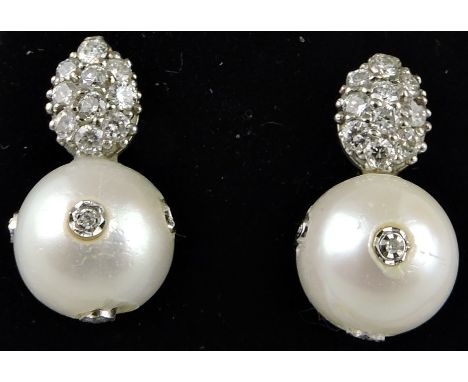 A pair of freshwater pearl and diamond set ear pendants.